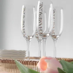 Hot Champagneglass, transparent/gull Borddekking
