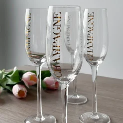 Hot Champagneglass, transparent/gull Borddekking