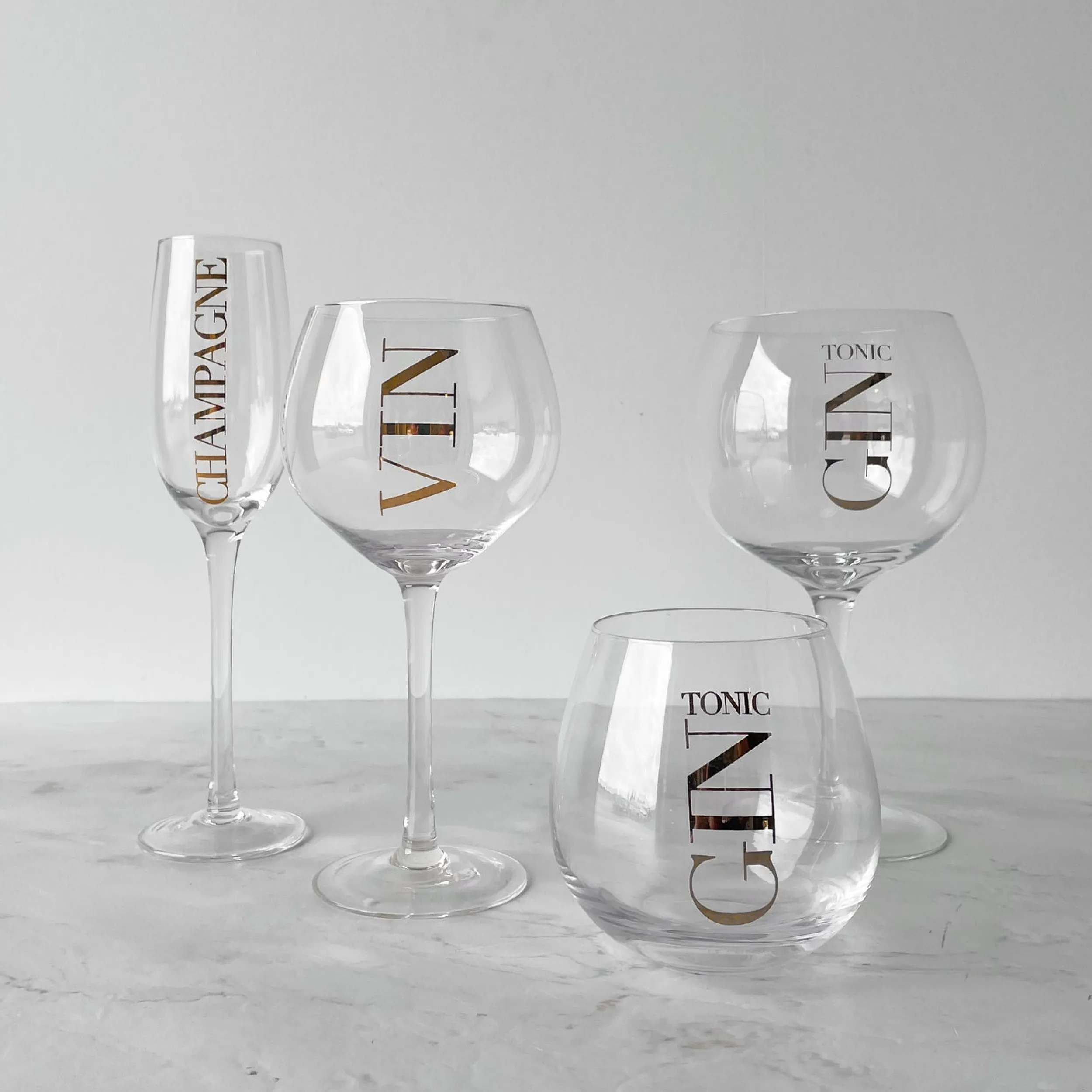Hot Champagneglass, transparent/gull Borddekking